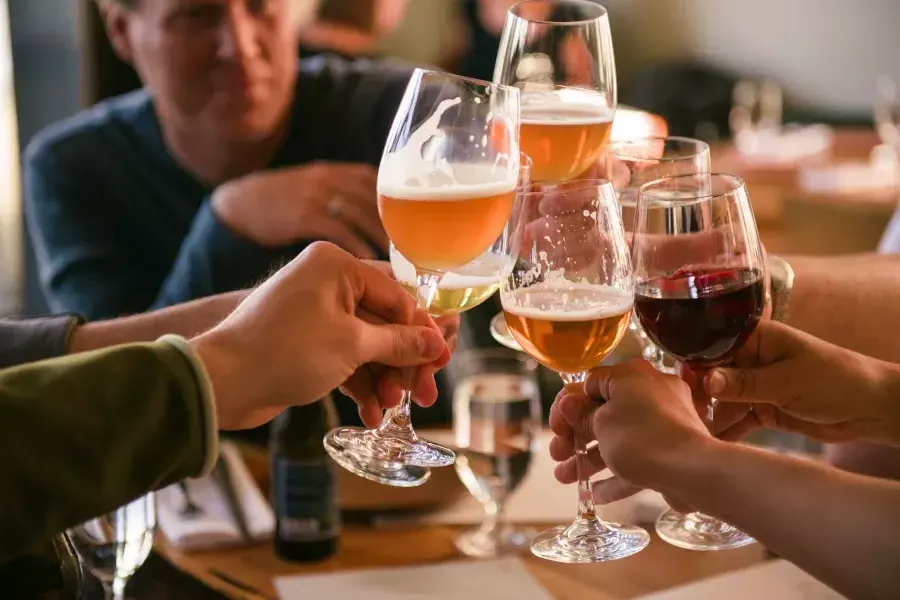 A group of travelers share a drink at a San Francisco bar.